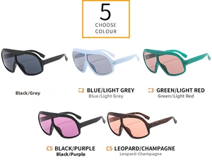 Flat lay of oversized sunglasses in black, blue, green, and leopard print options