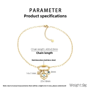 Detail view of gold stainless steel necklace with celestial star, moon and evil eye charms