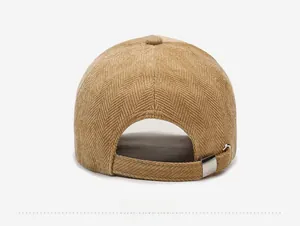 Rear view of corduroy baseball cap in khaki with adjustable metal buckle strap