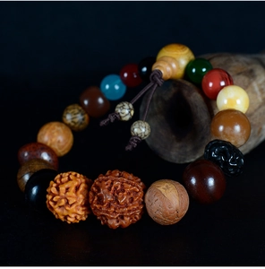 Macro detail of natural multi-material Bodhi seed bracelet beads with organic textures