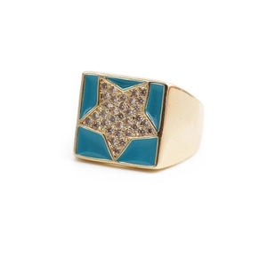 Macro view of gold signet ring with blue enamel and micro-set star cubic zirconia detail