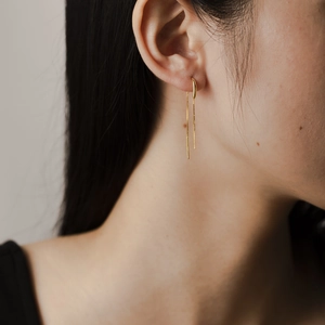 Elegant gold S925 sterling silver tassel drop earrings on model for minimalist style