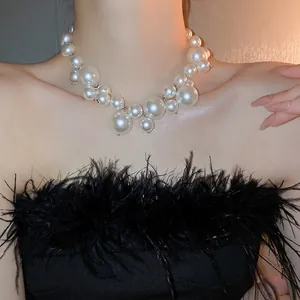 Exaggerated pearl necklace featuring varying sizes of lustrous white pearls for women