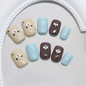 Cute coffee bear dot press-on nails with shiny finish and milk blue accents in 10-piece set