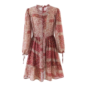 Back view of wine red A-line dress featuring floral prints and bow-tie cuff details
