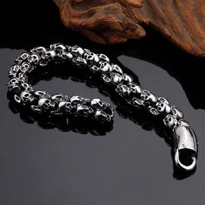 Close-up of vintage silver stainless steel skull chain bracelet with large lobster clasp