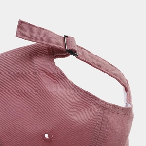 Pink cotton baseball cap with adjustable metal buckle and breathable eyelets back view