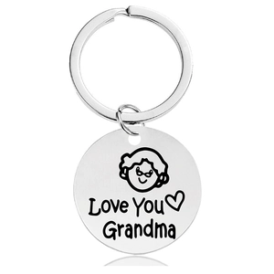 Detailed close-up of a stainless steel keychain with engraved Love You Grandma text