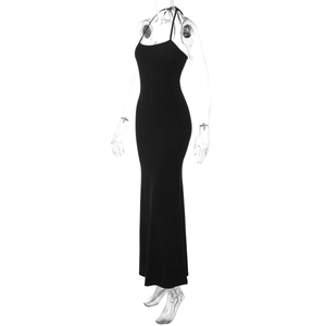 Side view of a slim fit black halter neck maxi dress with open back design on a ghost mannequin