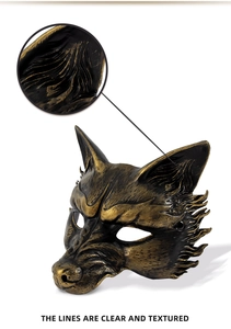 Detailed close-up of textured gold fox mask highlighting clear lines and antique finish
