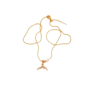 Elegant gold fishtail necklace with pearls and rhinestones on a minimalist white background