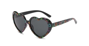 Detail of heart-shaped sunglasses with black frame and colorful star patterns