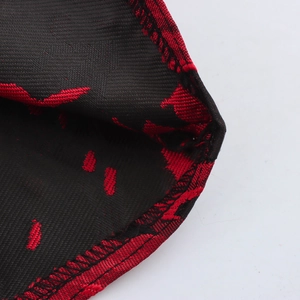 Elegant halter neck dress with red jacquard patterns and detailed sewing on the fabric edge