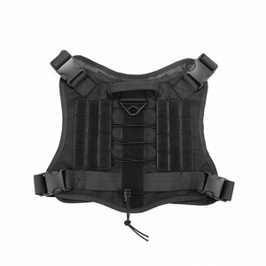 Top view of black tactical dog harness with nylon handle, metal D-ring and quick release buckles