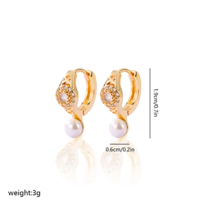 Detail shot of gold-plated earrings showing 1.9cm height with pearls and zircon