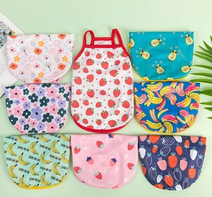 Detail view of breathable mesh pet vests in various fruit and floral summer patterns