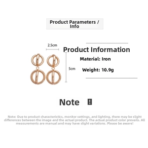 Detailed view of gold geometric hollow double ring earrings with polished metal finish