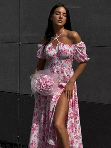 Detail of floral off-shoulder maxi dress with side slit and bubble sleeves for summer