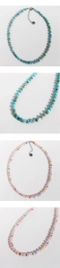 Detailed close-up of rainbow seed beads and turquoise stones on a dopamine style necklace