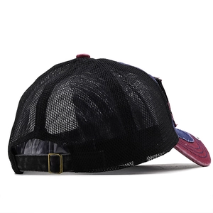 Detail of adjustable metal buckle and breathable mesh on retro outdoor trucker hat