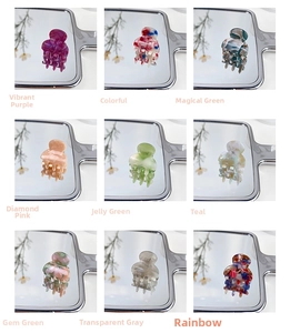 Detailed grid view of nine mini acetate claw clips in various colorful marble patterns