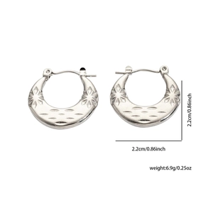 Detailed view of silver hoop earrings with star embossing and 2.2cm diameter measure