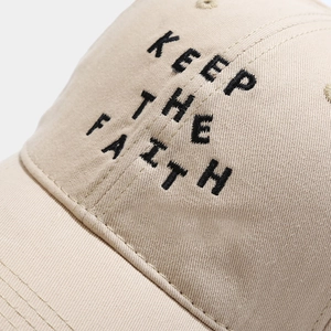 Khaki cotton baseball cap with KEEP THE FAITH embroidery detail and soft crown
