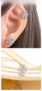 Macro shot of titanium steel flower earrings with colorful marquise-cut crystal petals