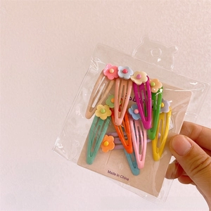 Detailed set of 10 colorful resin flower hair clips in macaron tones for children