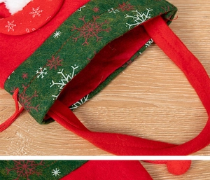 Detailed macro view of Christmas felt gift bag with red handle and snowflake patterns