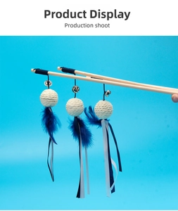 Detailed set of three wooden cat wands with bells, blue feathers and ribbons