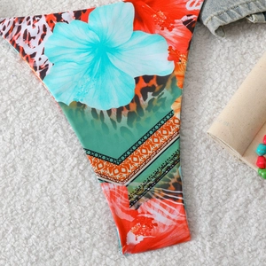 Close-up of bikini bottom with leopard print and hibiscus floral pattern details