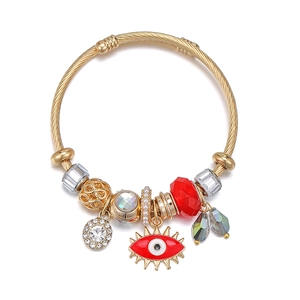 Gold evil eye charm bracelet with red crystal beads and sparkling rhinestone accents