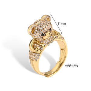 Detail of bear ring with white cubic zirconia pavé and size dimensions of 11mm by 13mm