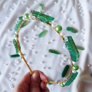 Handmade gold wire headband featuring green natural crystals and white pearls for women