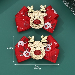 Detail view of handmade Christmas hair bow with reindeer sequin and size measurements