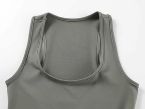 Close-up of dark grey square neck tank top showing high-density stitching and knit fabric