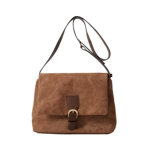 Brown faux suede crossbody bag with vintage golden horseshoe buckle and leather strap
