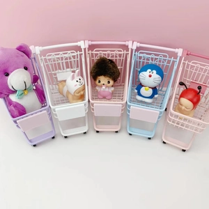 Set of mini metal shopping baskets in pastel colors for desk storage and organization
