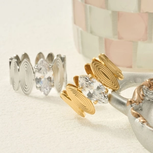 Vintage 18k gold and silver marquise cut zircon rings with spiral textured bands