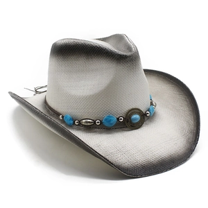Detail of woven cowboy hat with turquoise beads and vintage metal hardware accents