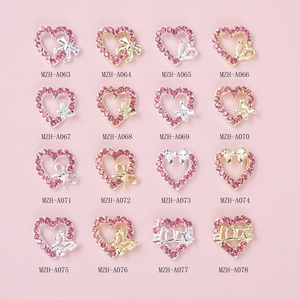 Pink heart and bow alloy nail art charms with 16 diverse designs in gold and silver finish