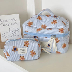 Blue striped quilted makeup bag set with cartoon bear prints and white ribbon zippers