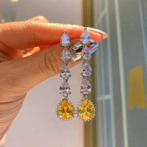 Detail of yellow pear-cut drop earrings featuring high-carbon diamonds and S925 silver setting