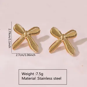 Golden stainless steel leaf-shaped stud earrings featuring a textured ribbed design