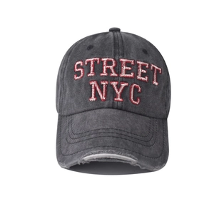 Close-up of distressed brim and 3D STREET NYC embroidery on washed grey baseball cap