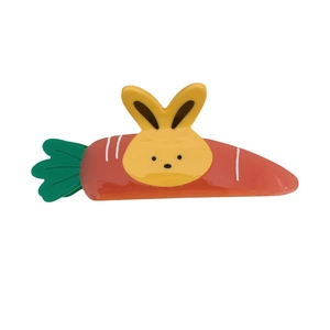 Cartoon rabbit and carrot claw clip for children with vibrant orange and green colors