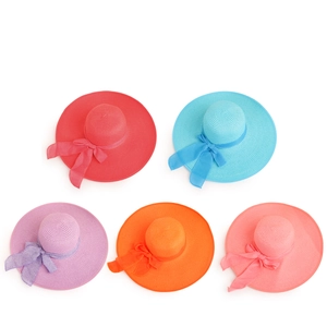 Women's wide brim sun hats with ribbon bows in various summer colors on white background