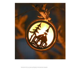 Close-up of Nordic wooden LED Christmas pendant with warm white light and hollow design