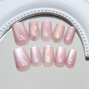 Pink gradient cat eye press-on nails with gold marble texture on mirror base